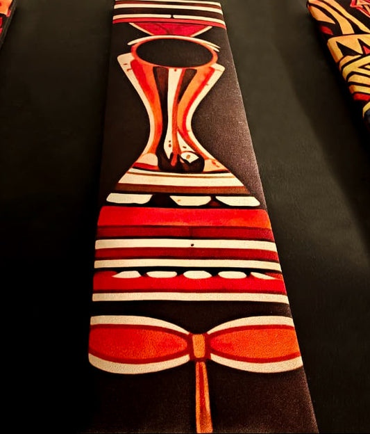 Colorful fabric with tribal patterns on a dark background